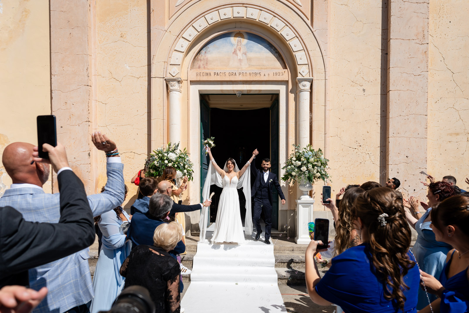 Newlyweds captured in a candid joyful moment in Amalfi