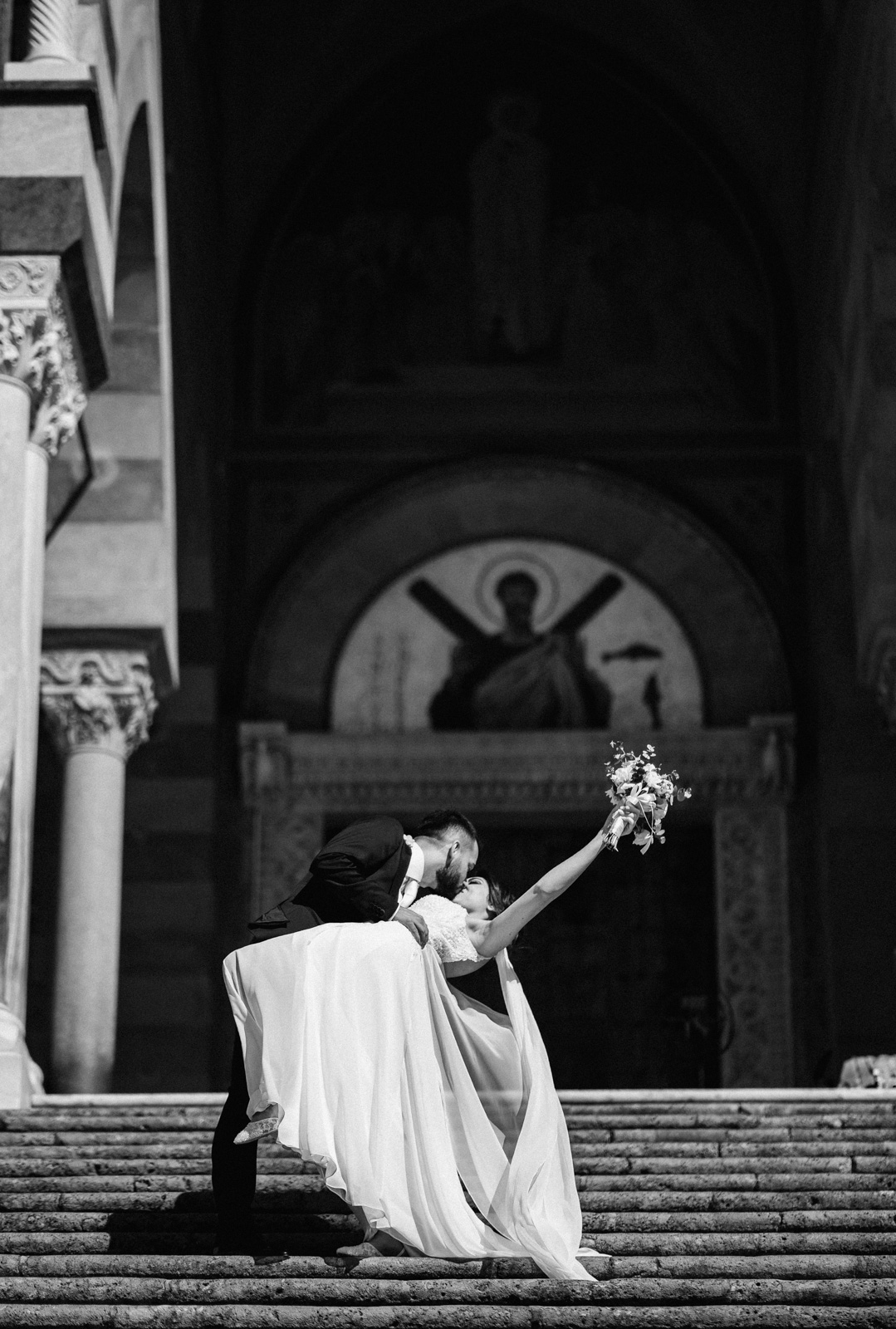 Newlyweds embracing on a charming Amalfi street