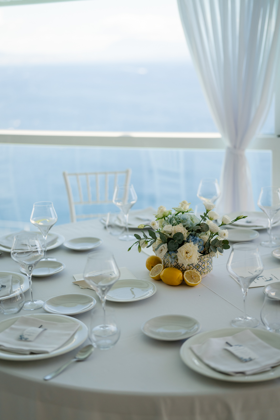 Wedding dinner setup with candles and Amalfi sea views